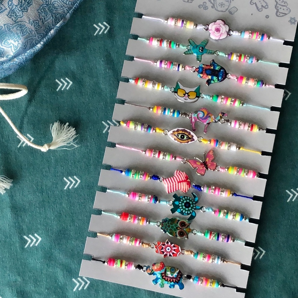 Set of 12 charm beaded cord bracelets